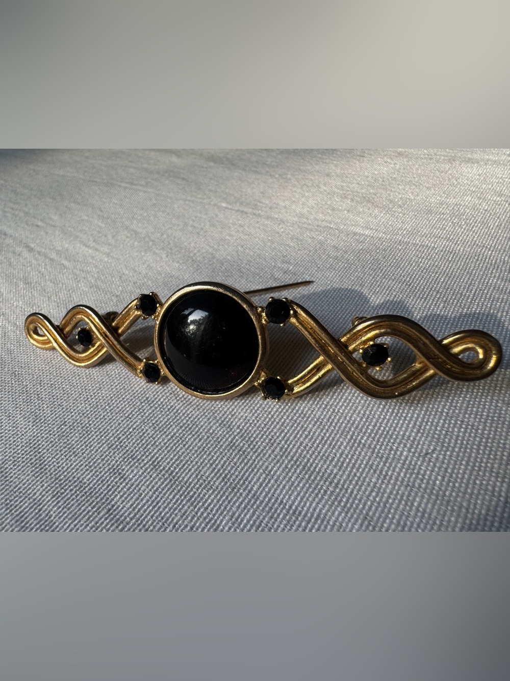 Vintage Carol Duplaise Gold-Tone Black Cabochon Scroll Brooch